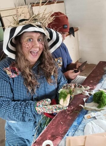 Scarecrow character making a fairy garden